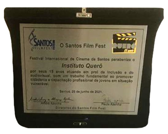 O Santos Film Fest � Festival Internacional de Cinema de Santos, entregou ao Instituto Quer� em 2021, uma placa em homenagem e parabeniza��o pelos 15 anos de atua��o �em prol da inclus�o e do audiovisual, com um trabalho fundamental ao promover cidadania e capacita��o profissional de jovens em situa��o vulner�vel�. 